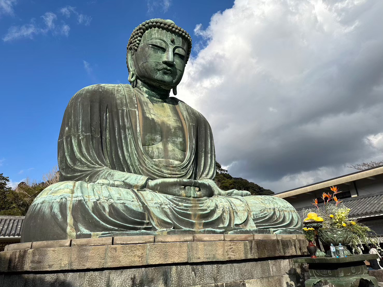 Close-up of Kamakura Great Buddha's face and shoulders showing bronze patina detail